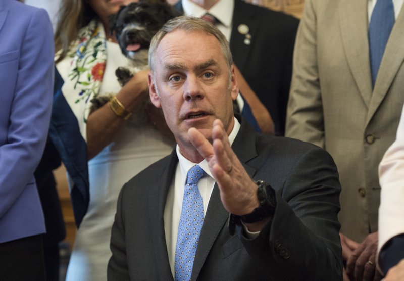 Interior Secretary Ryan Zinke speaks at the Interior Department in Washington, Wednesday, March 29, 2017, after signing an order lifting a moratorium on new coal leases on federal lands and a related order on coal royalties. 