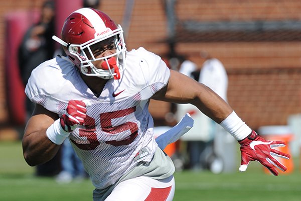Arkansas linebacker Dwayne Eugene takes part in a drill Saturday, April 1, 2017, during practice at the university practice field in Fayetteville.