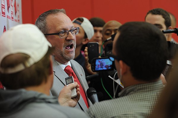 Arkansas women's basketball coach Mike Neighbors (left) speaks Tuesday, April 4, 2017, with members of the media during a ceremony and press conference to announce his hire at the university's basketball practice facility. Arkansas women's basketball coach Mike Neighbors (left) speaks Tuesday, April 4, 2017, with members of the media during a ceremony and press conference to announce his hire at the university's basketball practice facility.