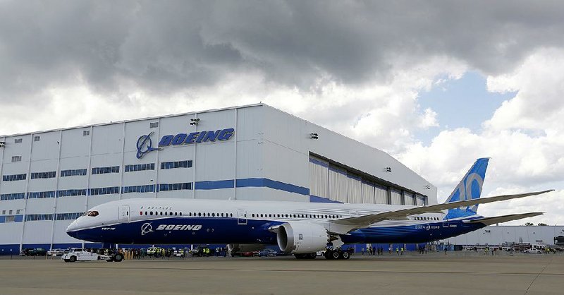 A Boeing 787-10 Dreamliner is towed back to the company’s plant in South Carolina after its first test flight Friday. Boeing’s new deal with Iran Aseman Airlines adds to the one the plane-maker already has with Iran Air.