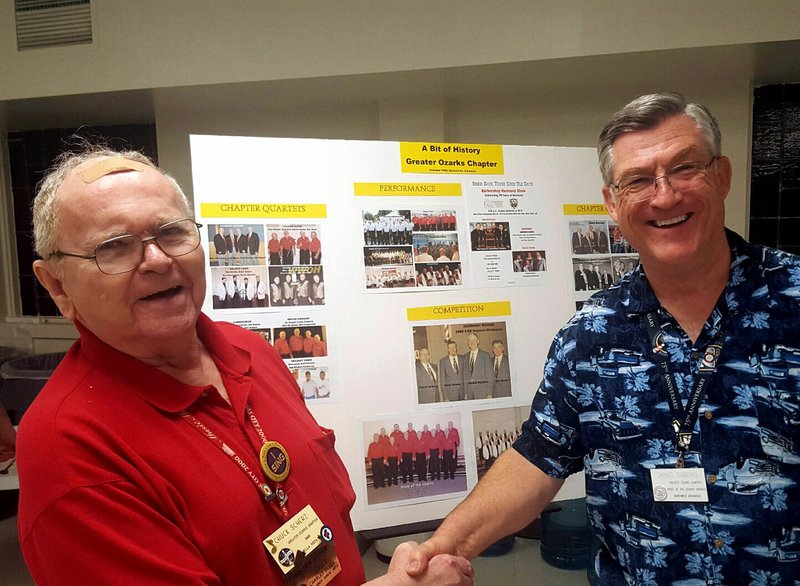 Greater Ozarks Chapter President Jim Gibbons congratulates Chuck Scherz on 65 years of Barbershop Harmony Society membership.