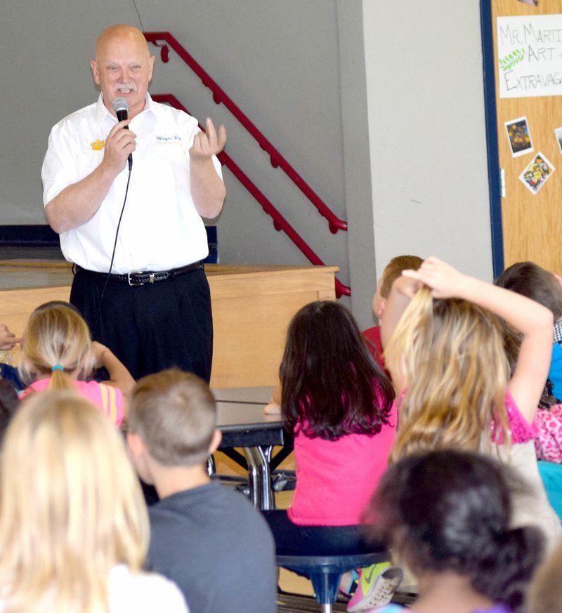 Photo by Mike Eckels Decatur Mayor Bob Tharp gave first and second grade students at Decatur Elementary School a pep talk March 31 as they got ready to take the Iowa Test April 4-7.
