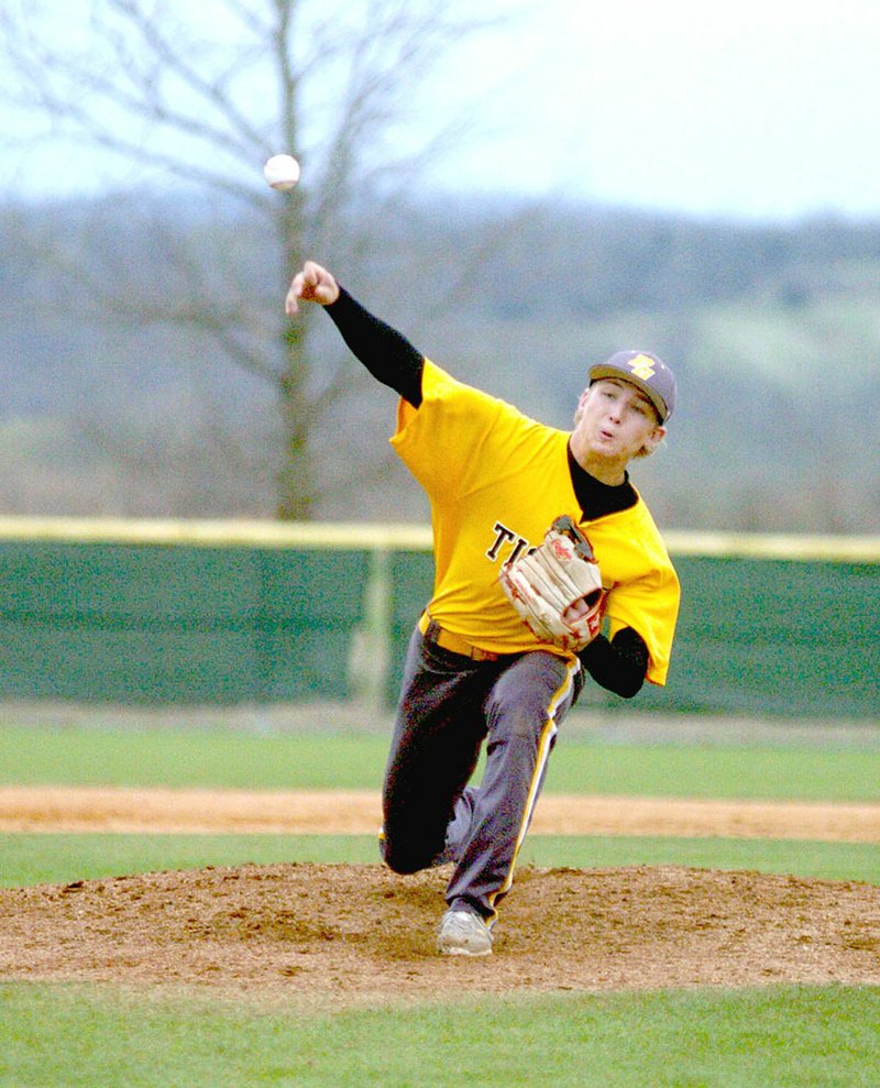 MARK HUMPHREY ENTERPRISE-LEADER Prairie Grove senior Clay Fidler throws a pitch against Ozark during the first Jarren Sorters Memorial Baseball Tournament. Fidler started against Shiloh Christian on Thursday. The Tigers lost to the Saints, 4-1.