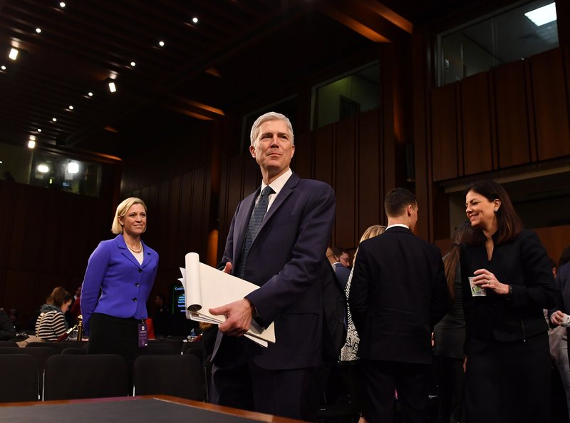 U.S. Supreme Court nominee Neil Gorsuch returns to testify after a short recess during the third day of his confirmation hearing by the Senate Judiciary Committee on March 22. MUST CREDIT: The Washington Post photo by Ricky Carioti.