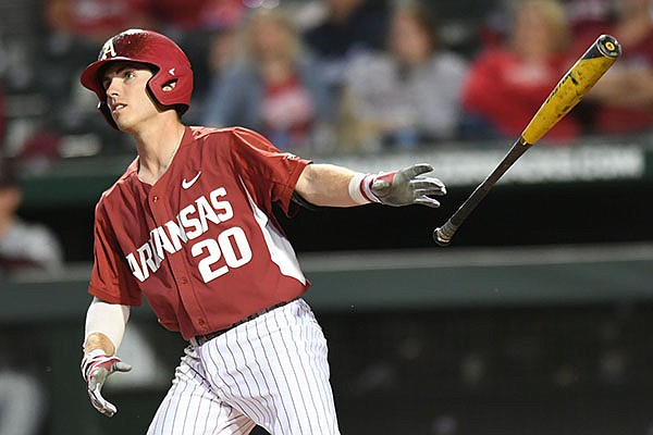 Arkansas second baseman Carson Shaddy tosses his bat after hitting a 2-run home run against Mississippi State Saturday, March 18, 2017, during the second inning at Baum Stadium in Fayetteville.