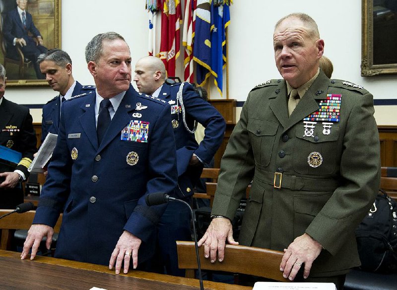 Air Force Gen. David Goldfein (left) and Marine Corps Gen. Robert Neller testify Wednesday in Washington about the problems that stopgap defense spending measures pose for the military.