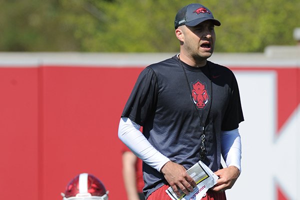 Arkansas assistant coach Barry Lunney Jr. directs his players Saturday, April 1, 2017, during practice at the university practice field in Fayetteville. 