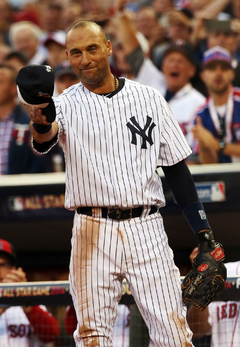 American League shortstop Derek Jeter, of the New York Yankees, waves as he is taken out of the game in the top of the fourth inning of the MLB All-Star baseball game, Tuesday, July 15, 2014, in Minneapolis. 