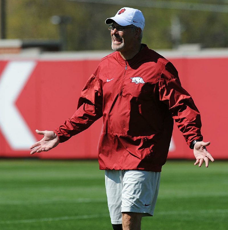 NWA Democrat-Gazette/ANDY SHUPE
Arkansas defensive coordinator Paul Rhoads speaks to his players during a drill Saturday, April 1, 2017, during practice at the university practice field in Fayetteville. Visit nwadg.com/photos to see more photographs from practice.