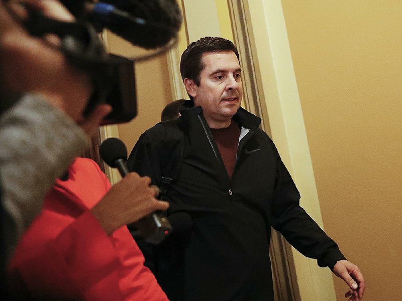 House Intelligence Committee Chairman Rep. Devin Nunes, R-Calif., is pursued by reporters Thursday as he leaves a meeting with House Majority Leader Kevin McCarthy. He said an ethics filing against him is “entirely false and politically motivated.”
