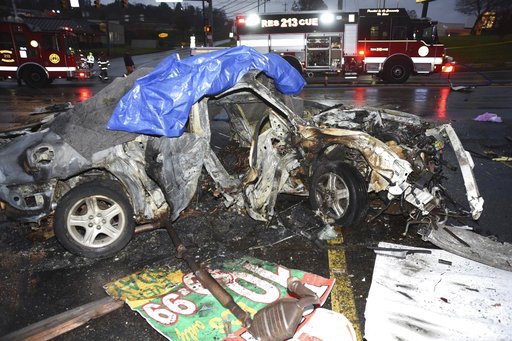 This Thursday, Nov. 24, 2016, photo provided by the Allegheny County district attorney's office shows wreckage of a car in which David Bianco, his fiancee, Kaylie Meininger, and her 2-year-old daughter, Annika, were killed during a crash in North Versailles, Pa. 