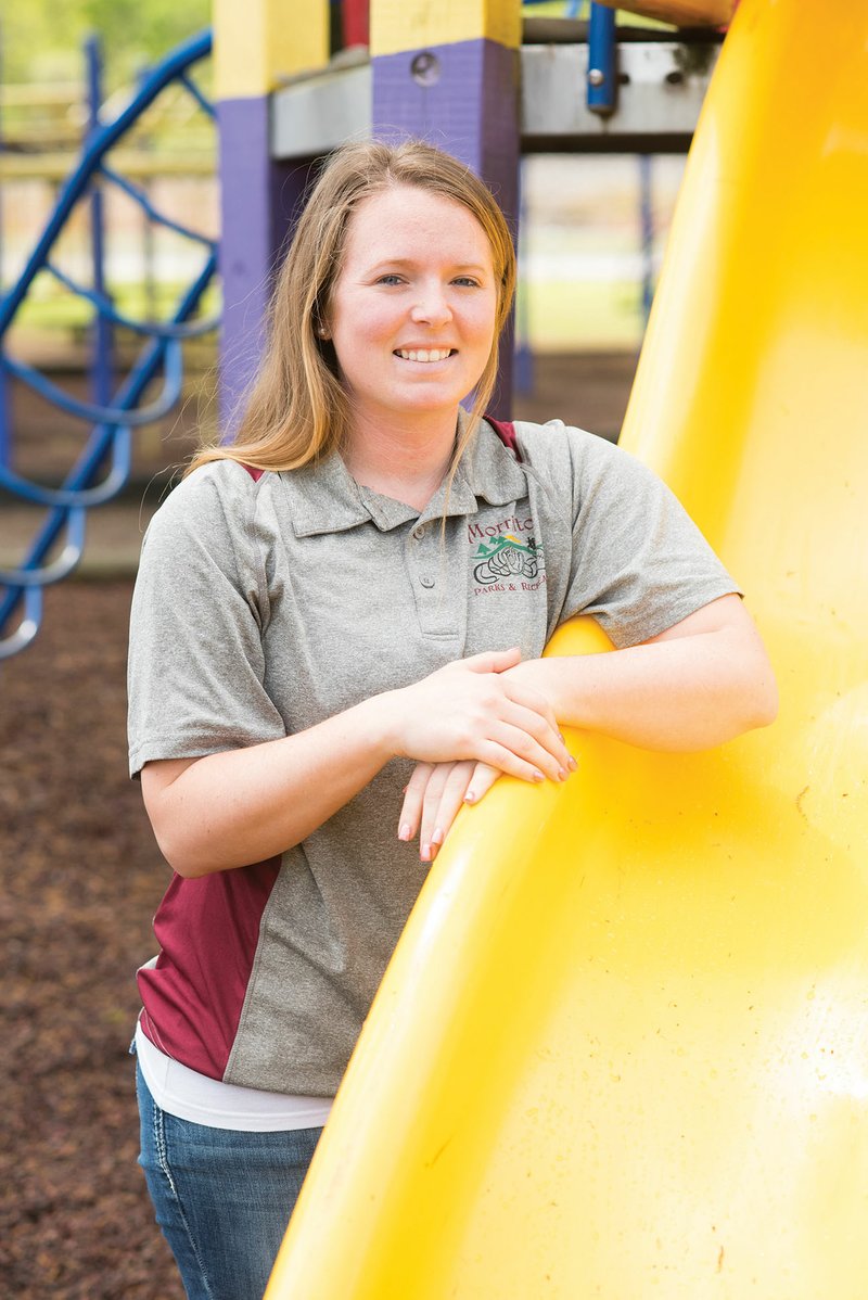 Hanna Ross, the incoming director of the Morrilton Parks and Recreation Department, stands in Morrilton City Park. Ross, 25, is the only female city department head, Mayor Allen Lipsmeyer said. She worked for the department for years before becoming program director a year ago. She will fill the position being vacated by Larry Tarrant, who is taking a banking job in Cabot.