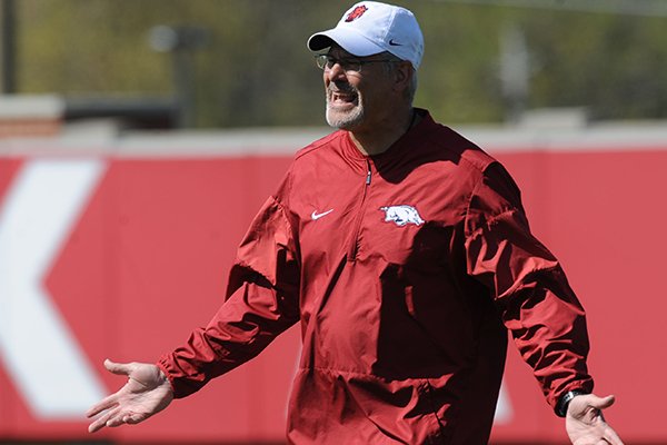 Arkansas defensive coordinator Paul Rhoads speaks to his players during a drill Saturday, April 1, 2017, during practice at the university practice field in Fayetteville. 