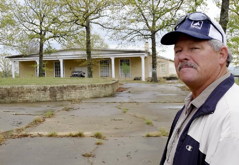 Mike Morrell stands outside the mansion built in the 1970s for evangelists Tony and Susan Alamo. Morrell said he would like to see the mansion fixed up and used as a foster home or perhaps a church ministry. 

