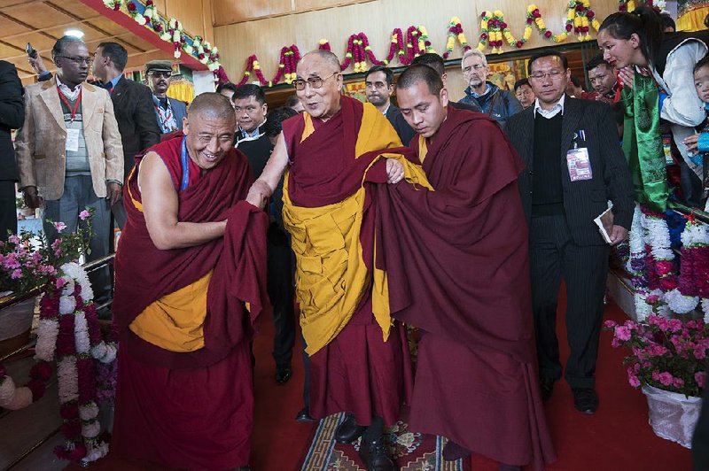 The Dalai Lama prepares to address followers Saturday in Tawang, India. His visit to India’s Arunachal Pradesh state has drawn protests from China, which claims part of the state as its territory.