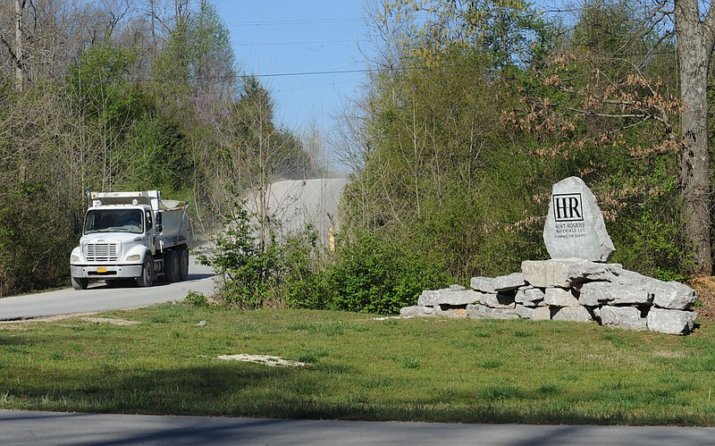 In this file photo a dump truck makes it way out of a limestone quarry past a sign for the Hunt-Rogers Materials' Farmington quarry on Hamestring Road.
(NWA Democrat-Gazette/ANDY SHUPE)