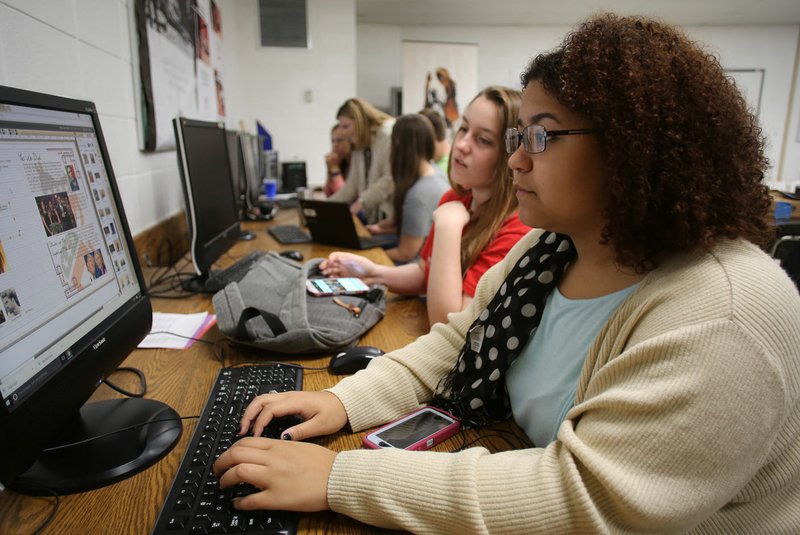 Kirsten Keels (from right), a senior at West Fork High School, works Friday with Andrea Womack, a senior and editor, on the annual yearbook in Sarah Jones’ journalism class at the school. The district has more seniors than kindergarten students. Some of the trend is because of an aging population in West Fork, a lack of jobs within the city and a lack of housing. The high school is working to expand offerings to students, despite being a small school.