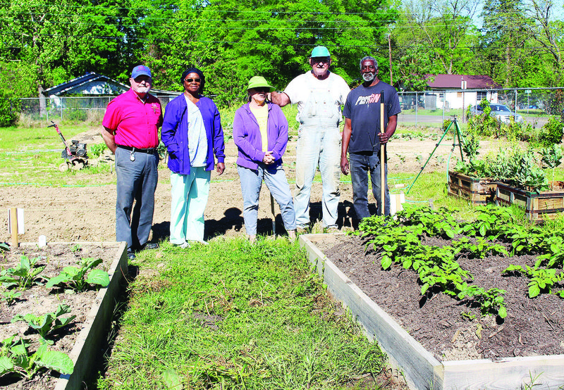 Gardening: Volunteers work together at the Southside Community Garden, which is located on the corner of Jackson and Pecan Streets. Robin Bridges, far left, spoke about "Gardening for Healthier Communities" at the TOUCH Coalition meeting on Tuesday, April 4. 