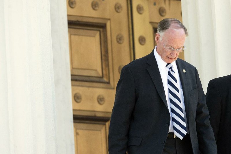 Gov. Robert Bentley leaves the Alabama Capitol on Monday in Montgomery.