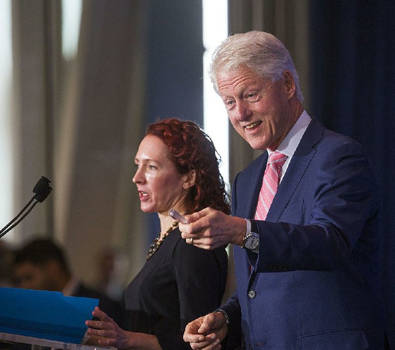 Former President Bill Clinton introduces Catherine Finn, deputy editor of Harvard Health Publications, during the Clinton Foundation’s sixth annual Health Matters Activation Summit on Monday at the Clinton Presidential Center in Little Rock.