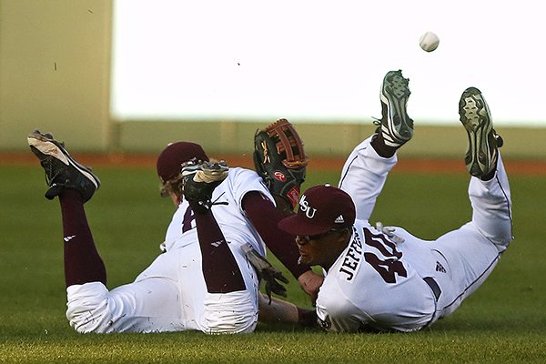 Missouri State infielder Aaron Meyer (8) and outfielder Alex Jefferson (40) collide while pursuing a ball during second inning action of an NCAA college baseball game between Missouri State and Arkansas at Hammons Field in Springfield, Mo. on Tuesday, April 11, 2017. (Guillermo Hernandez Martinez/News-Leader via AP)

