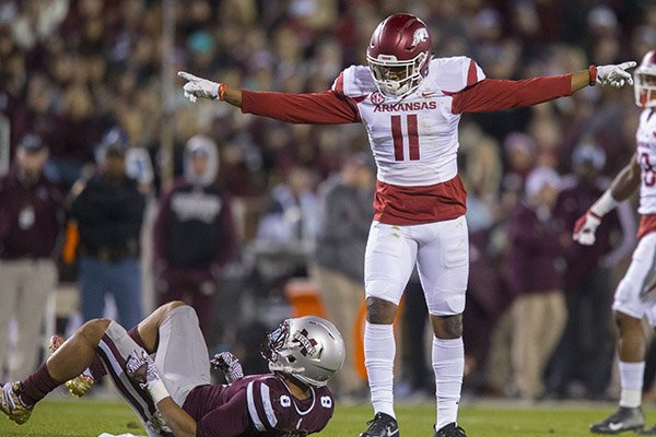 Arkansas defensive back Ryan Pulley (11) celebrates after breaking up a pass intended for Mississippi State Bulldogs Fred Ross (8) on Saturday, Nov. 19, 2016, at Davis Wade Stadium in Starkville, Miss., during the second quarter.
