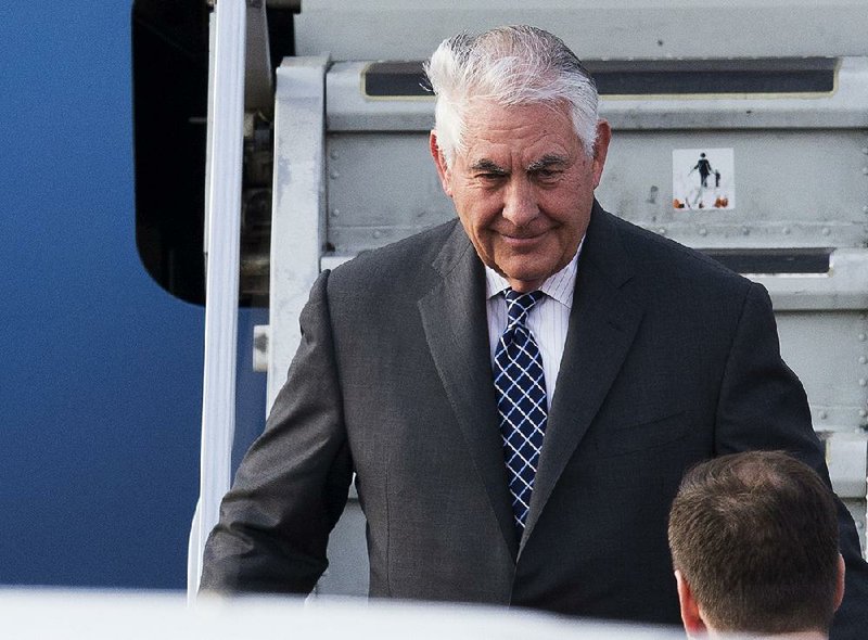 Secretary of State Rex Tillerson steps off his plane Tuesday in Moscow. As he landed, White House officials in Washington accused Russia of a disinformation campaign on Syria’s chemical attack.