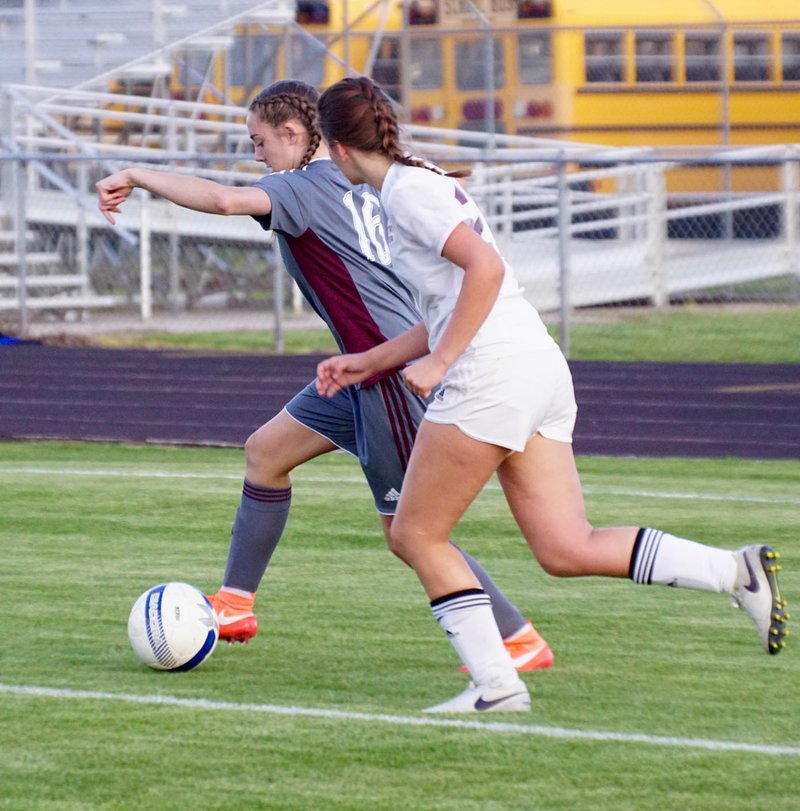 Photo by Randy Moll Liliana Navarette (15) tries to catch up to Shelby Johnson of Siloam Springs to steal the ball during play between the two teams in Gentry on Friday.