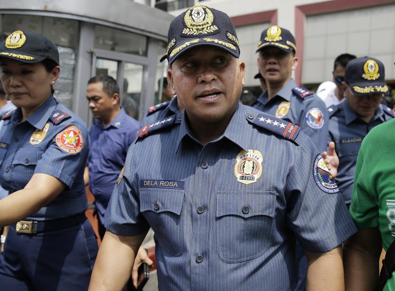 Philippine National Police Chief Ronald dela Rosa walks after an anti-terror simulation exercise at a bus terminal in Quezon city, north of Manila, Philippines on Tuesday, April 11, 2017. Dela Rosa said at least several people have been killed in battle between government forces and suspected Abu Sayyaf militants on a central resort island, far from the extremists' southern jungle bases and in a region where the U.S. government has warned the gunmen may be conducting kidnappings. (AP Photo/Aaron Favila)
