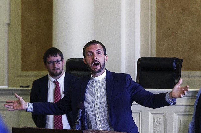 Arkansas Democrat-Gazette/MITCHELL PE MASILUN --4/12/2017--
Dr. Clint Schnekloth, Pastor at Good Shepard Lutheran Church in Fayetteville, speaks during the Arkansas Coalition to Abolish the Death Penalty press conference in the Old Supreme Court Room of the State Capitol Wednesday, April 12, 2017.