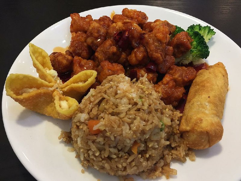 A lunch portion of General Tso’s Chicken comes with a choice of rice (fried is pictured here), crab rangoon, an egg roll and a few pieces of broccoli at Mr. Hui’s Restaurant in Little Rock. 