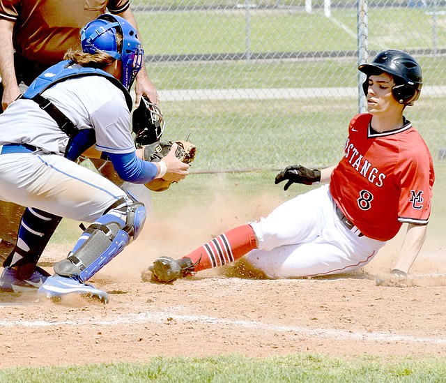McDonald County&#8217;s Tyler Stoutsenberger gets tagged out at home plate but the Mustangs still managed to come up with a 9-1win over Miami in the third place game of last week&#8217;s Mickey Mantle Wood Bat Tournament in Commerce, Okla.