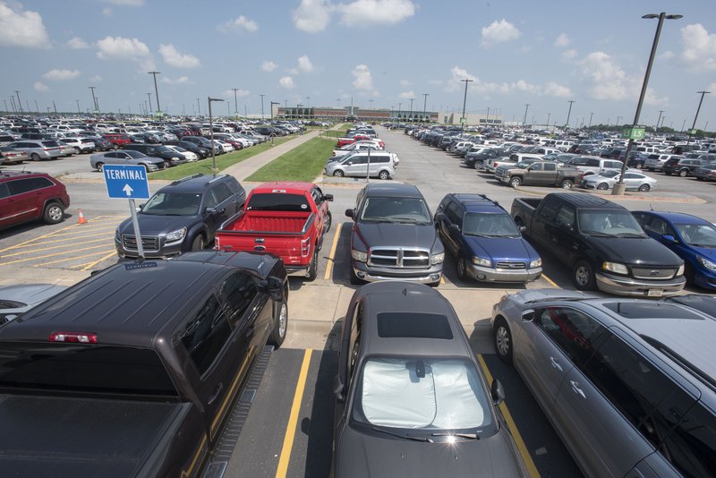 NWA Democrat-Gazette/File Photo Vehicles pack the parking lot at the Northwest Arkansas Regional Airport.