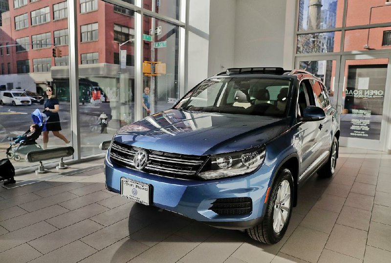 A 2018 Volkswagen Tiguan is displayed in the showroom Tuesday at the company’s flagship store in New York during a media preview for the New York International Auto Show, which begins today.