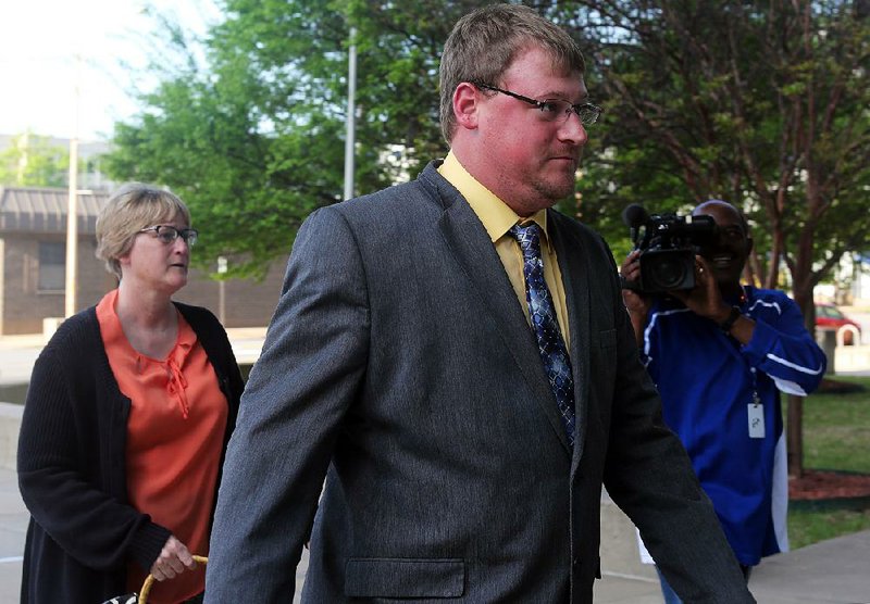 FILE — Former Little Rock police officer Josh Hastings arrives with his mother, Jan, on April 13, 2017, at the federal courthouse in Little Rock.