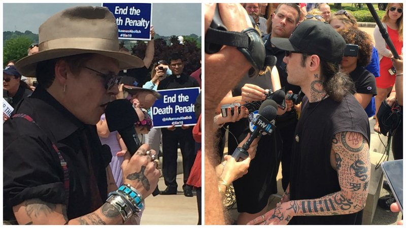 Actor Johnny Depp (left) and Damien Echols (right), who spent nearly 18 years on Arkansas' death row before being freed, appear at an anti-execution rally Friday, April 14, 2017, on the steps of the state Capitol in Little Rock. 
