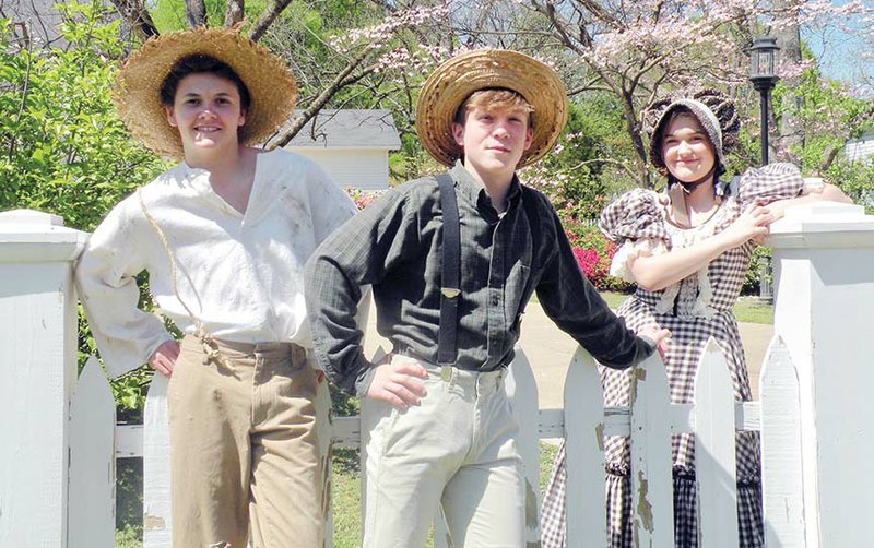 Ready for their upcoming performances in The Adventures of Tom Sawyer the Broadway Musical are Will Porter, from left, who plays Huckleberry “Huck” Finn; Luke Foster, who plays Tom Sawyer; and Annslee Clay, who plays Becky Thatcher.