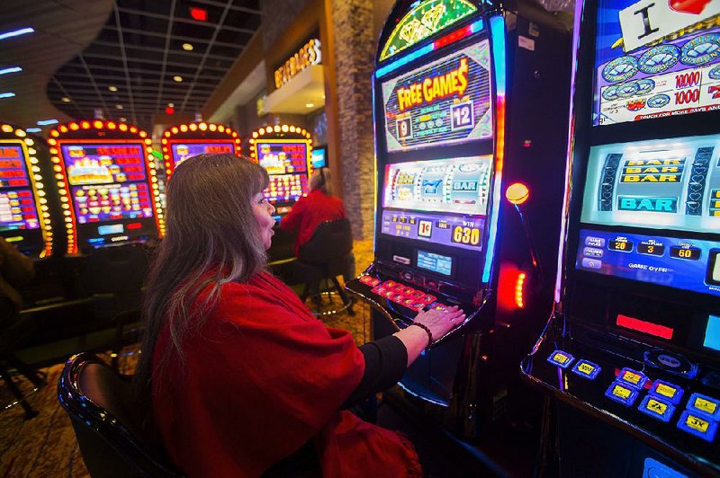 Pam Thurman of Grove, Okla., plays on a machine at Cherokee Casino in Grove. In 2015 — the latest year available — gambling operations run by American Indian tribes for the first time bested other gambling segments. 