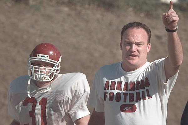 Arkansas defensive coordinator Keith Burns instructs players during practice April 2, 1998, in Fayetteville. 