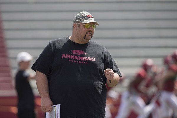 Arkansas offensive line coach Kurt Anderson watches practice Saturday, April 8, 2017, in Fayetteville. 