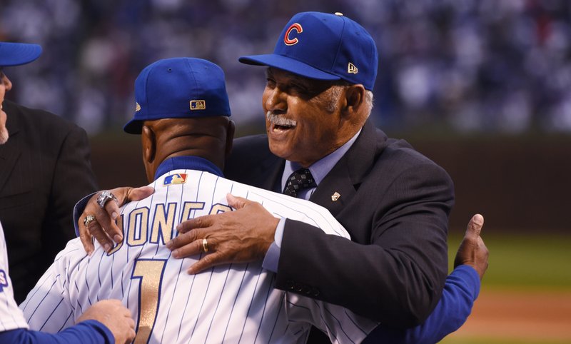 Hall of Famer Billy Williams (right), one of the all-time Chicago Cubs greats honored with a World Series ring this week, celebrates with the team’s third base coach Gary Jones. 