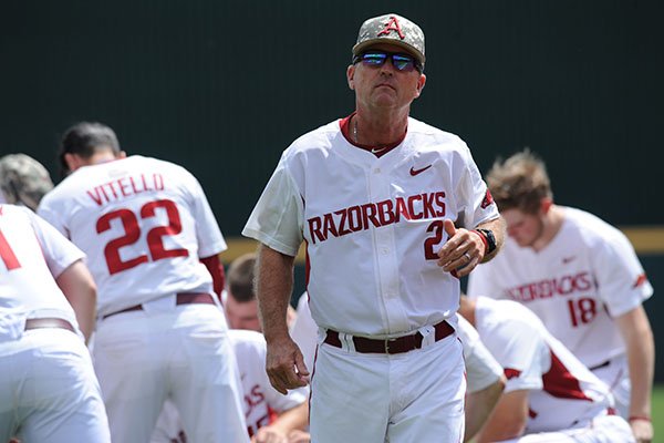 Arkansas coach Dave Van Horn walks toward the dugout prior to a game against Georgia on Saturday, April 15, 2017, in Fayetteville. 