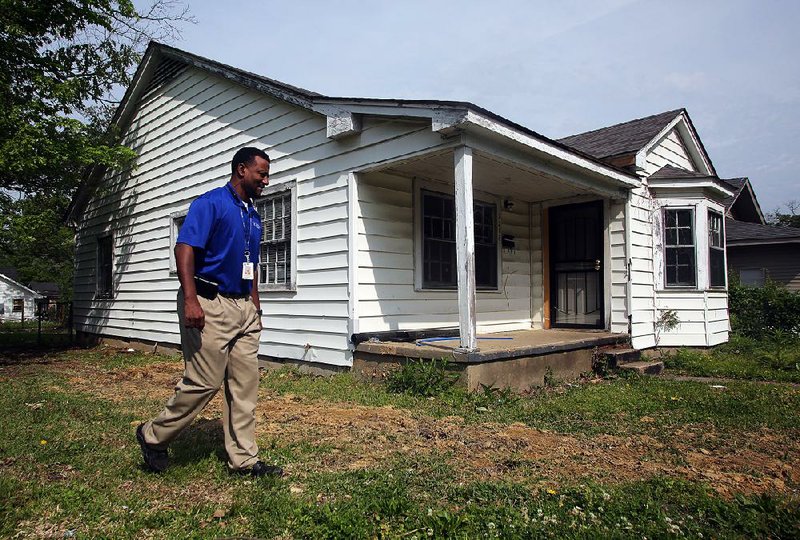 Kevin Howard, Little Rock’s community development manager, shows the city’s latest housing rehabilitation effort, at 2218 S. Martin St., on Friday. The city is buying and renovating properties in the Love neighborhood in an effort to spur more private investment in the area.