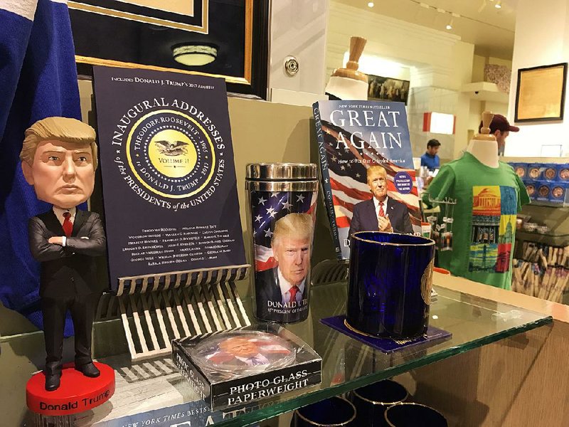 A President Donald Trump bobblehead doll sits among other presidential offerings at the National Archives gift shop in Washington.