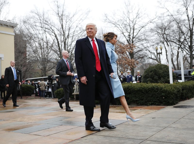 In this Jan. 20, 2017 file photo, then-President-elect Donald Trump and his wife Melania walk to their vehicle after attending church service at St. John's Episcopal Church across from the White House in Washington.