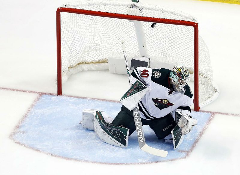 A shot by St. Louis’ Colton Parayko sails over the head of Minnesota goalie Devan Dubnyk for a goal during the first period of the Blues’ 3-1 victory in an NHL Western Conference series.