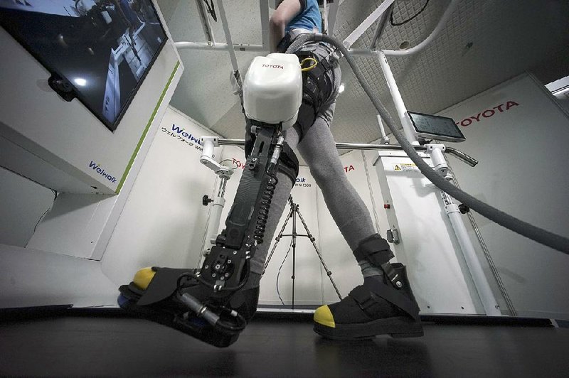 Toyota Motor Corp.’s Welwalk WW-1000 system is made up of a motorized mechanical frame that fits on a person’s leg from the knee down.