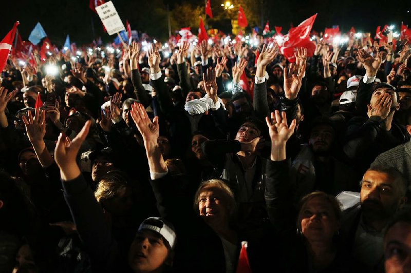 Supporters of Turkish President Recep Tayyip Erdogan celebrate Sunday in Istanbul.