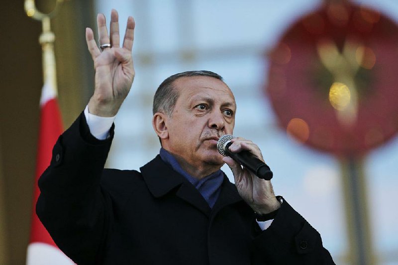 Turkish President Recep Tayyip Erdogan speaks to supporters Monday during a rally outside the presidential palace in Ankara, a day after voters approved constitutional changes to expand Erdogan’s powers.