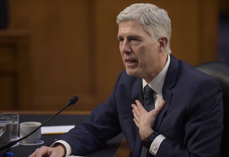In this March 22, 2017 file photo, then-Supreme Court Justice nominee Neil Gorsuch testifies on Capitol Hill in Washington.